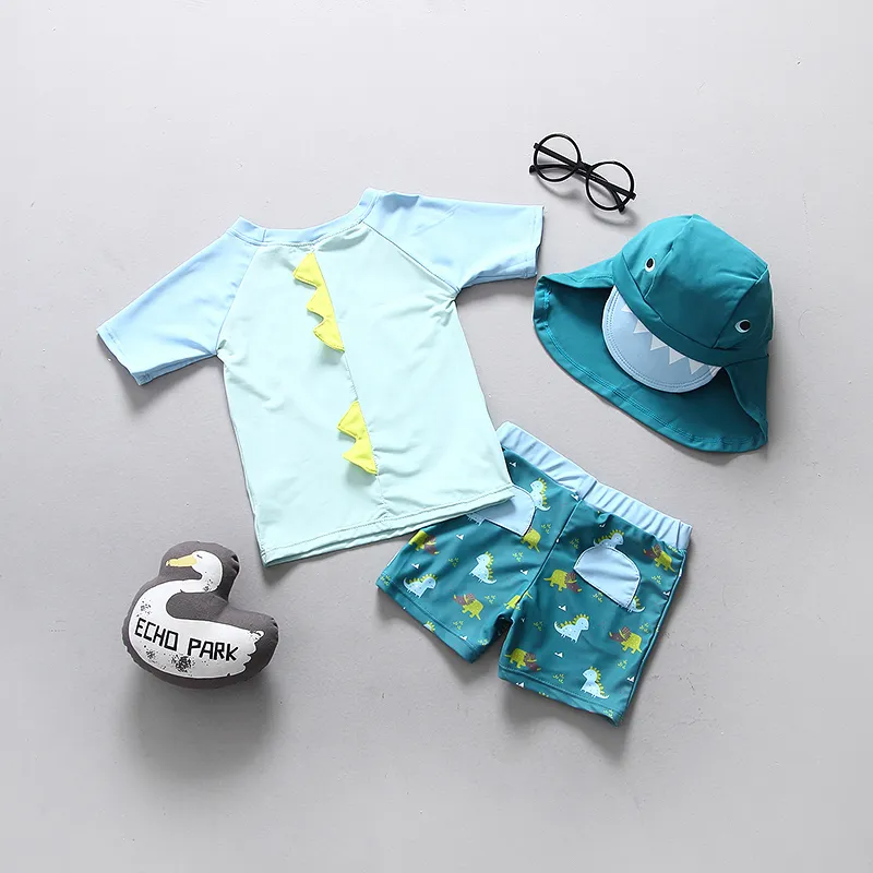 Kids Boys Cute Cartoon Dinosaur Round Neck Short Sleeve Top And Elastic Bottom With Cap Swimwear Set