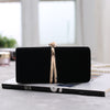 Ou Meimei holding a hard box small square bag dinner bag