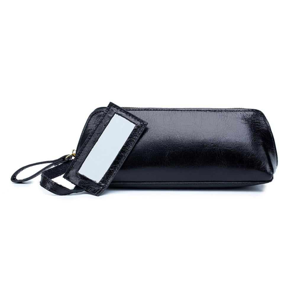 Portable female hand holding cosmetic bag