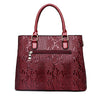 Ladies Handbag In Patent Leather Snake Print