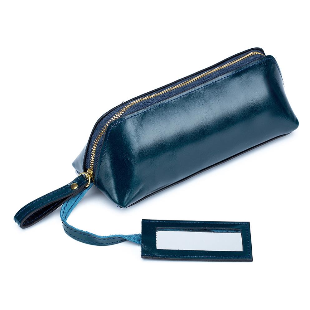 Portable female hand holding cosmetic bag